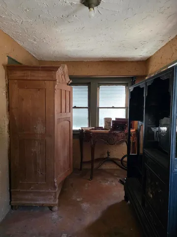 a kitchen with wooden floors and a sink