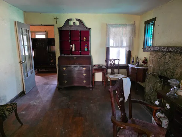a living room with furniture a rug and a fireplace