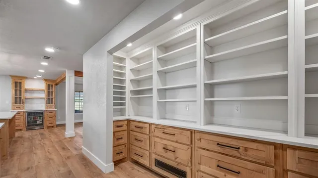 a room with cabinets and wooden floor