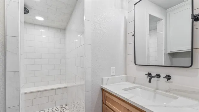 a bathroom with a sink and a bathtub