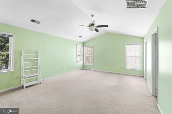 a bathroom with a double vanity sink mirror and shower