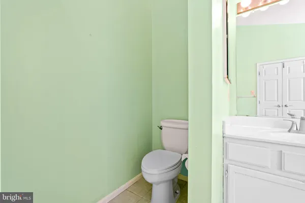 a view of residential houses with snow on the road