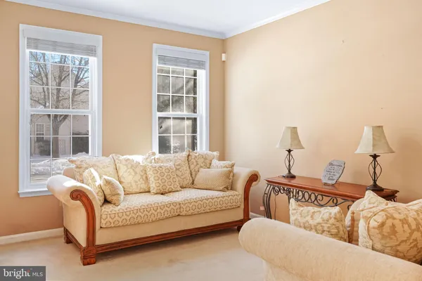 a living room with furniture and window