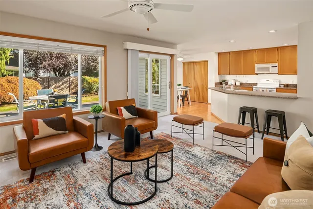 a living room with furniture and a large window