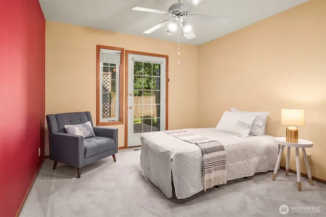 a spacious bedroom with a bed and a couch