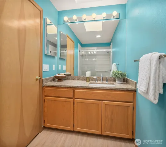 a bathroom with a sink and a mirror
