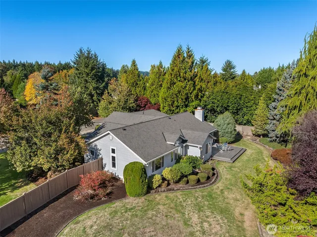 an aerial view of a house having yard