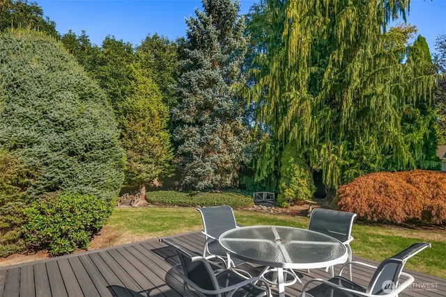 a view of a chairs and table on the deck