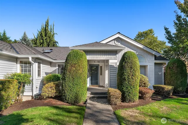 a front view of a house with garden