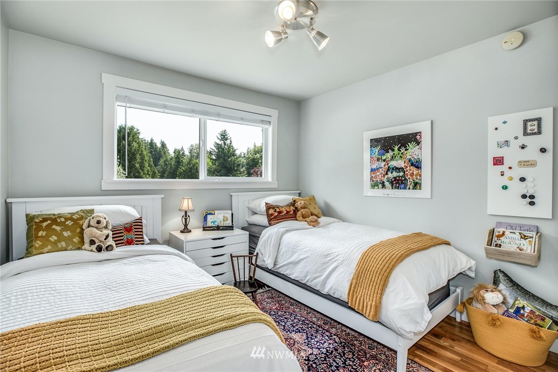 21910 1st Place West Bothell, WA 98021 - Photo 14 of 33 a bedroom with two beds and a large window
