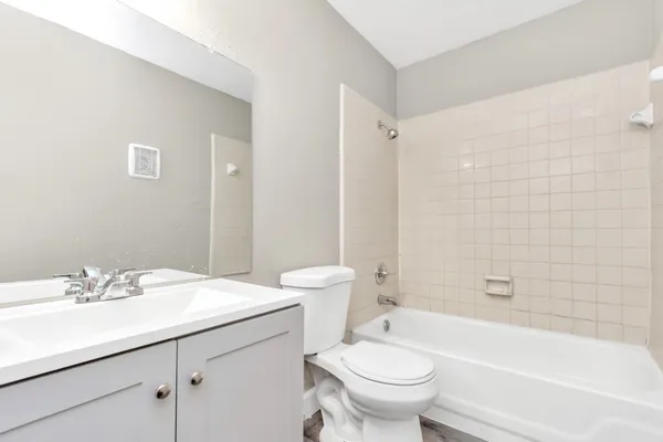 a bathroom with a sink a toilet and a bathtub