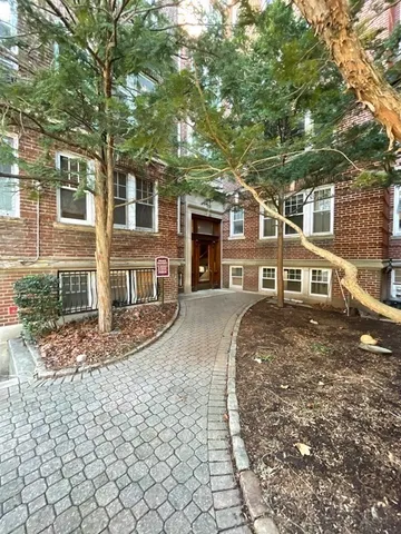 front view of a house with a trees