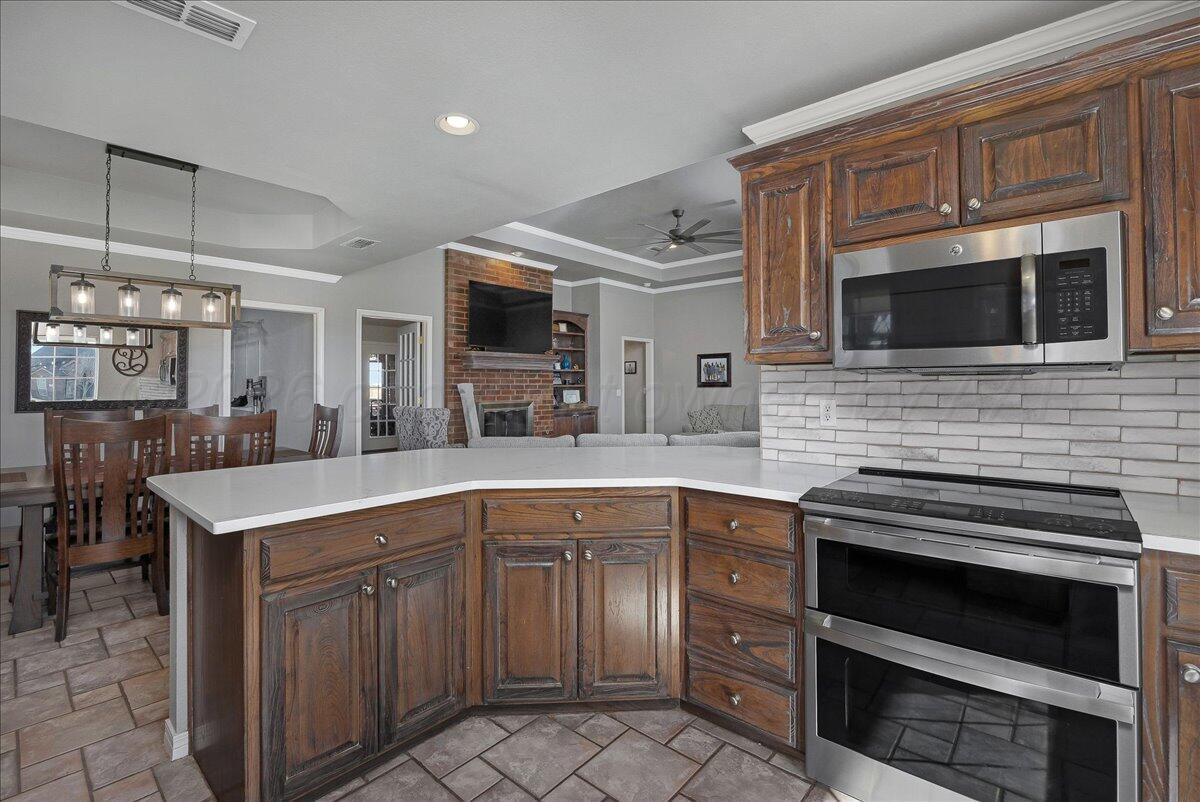 8910 Dove Road Canyon, TX 79015 - Photo 18 of 47 a kitchen with a sink and cabinets