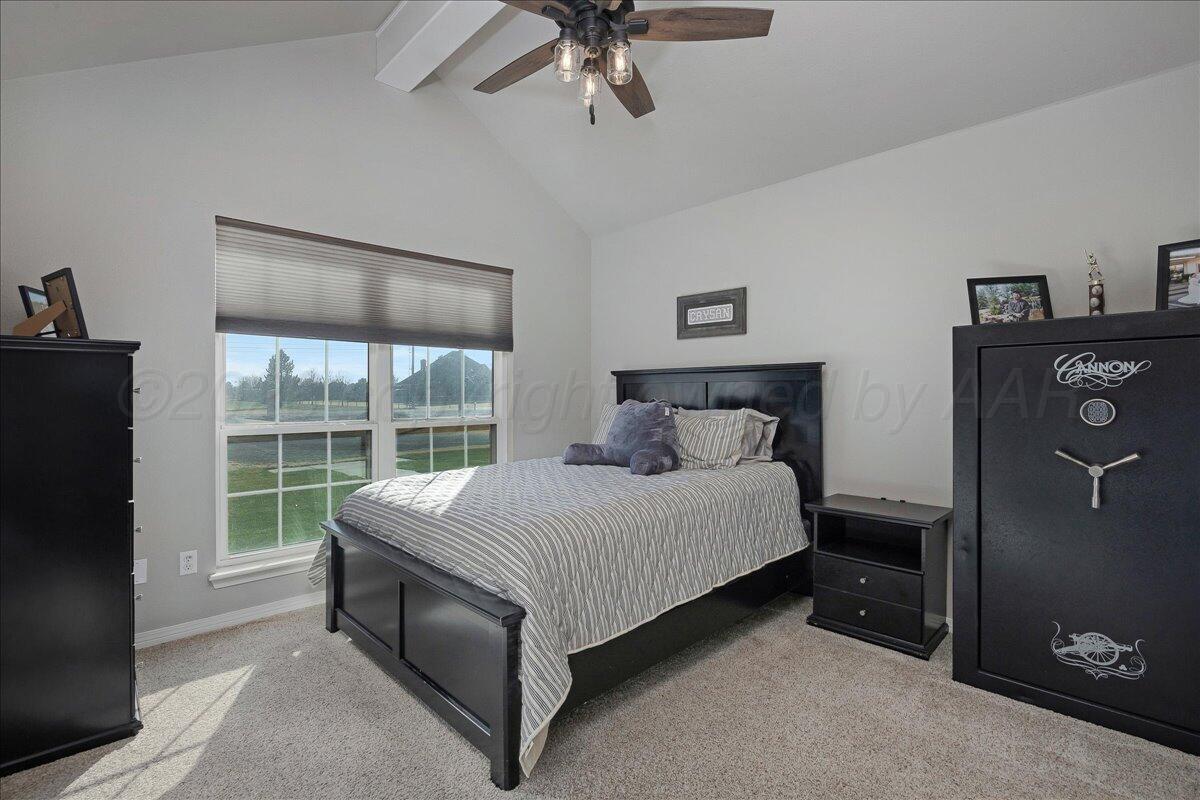8910 Dove Road Canyon, TX 79015 - Photo 27 of 47 a large bed sitting in a bedroom next to a window