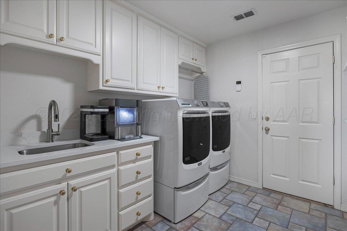 8910 Dove Road Canyon, TX 79015 - Photo 31 of 47 a kitchen with white cabinets and white appliances