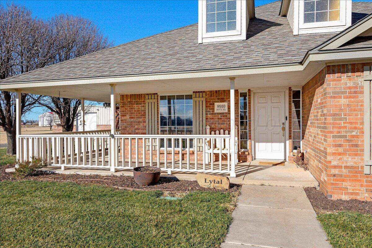 8910 Dove Road Canyon, TX 79015 - Photo 8 of 47 a view of a house with wooden deck and furniture