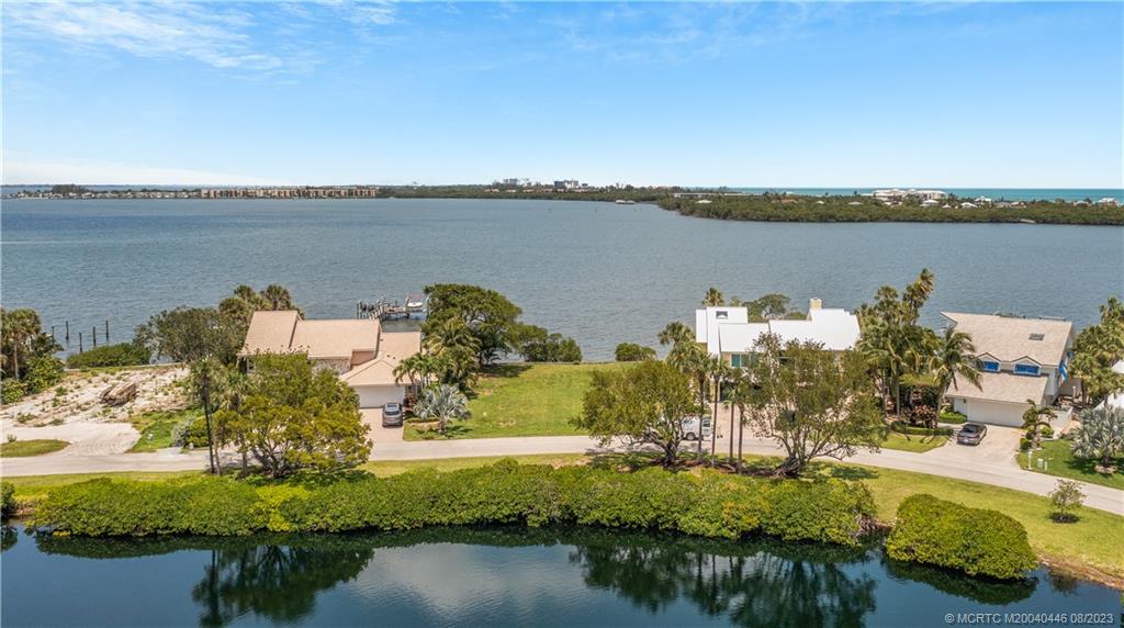 4070 Northeast Joes Point Road Stuart, FL 34996 - Photo 3 of 19 a view of a lake with a house