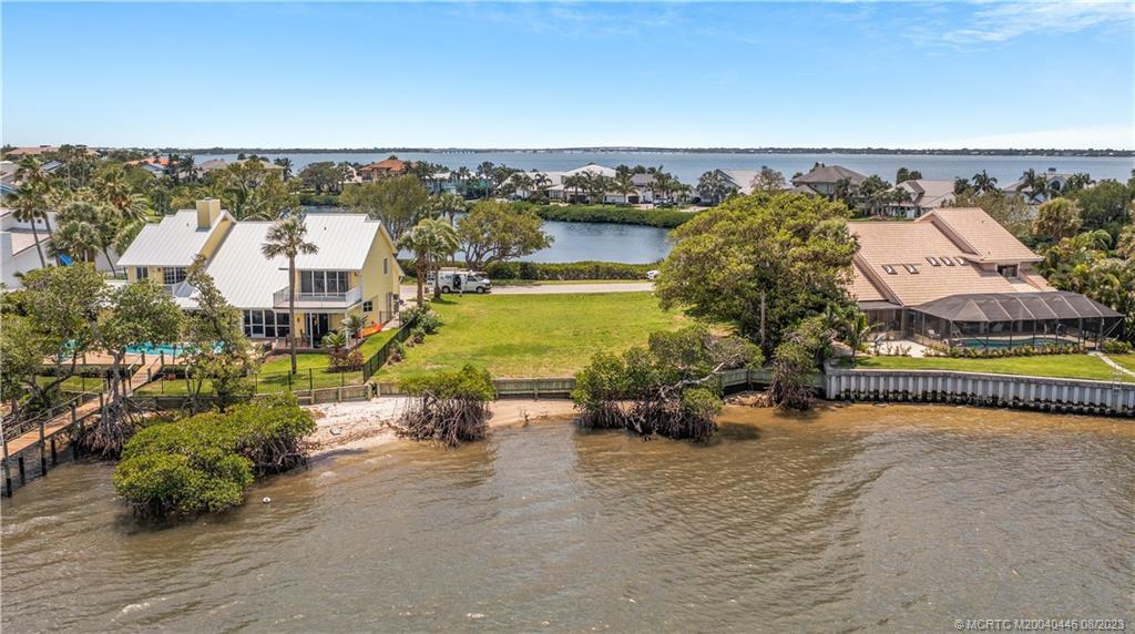 4070 Northeast Joes Point Road Stuart, FL 34996 - Photo 8 of 19 an aerial view of a house with a garden