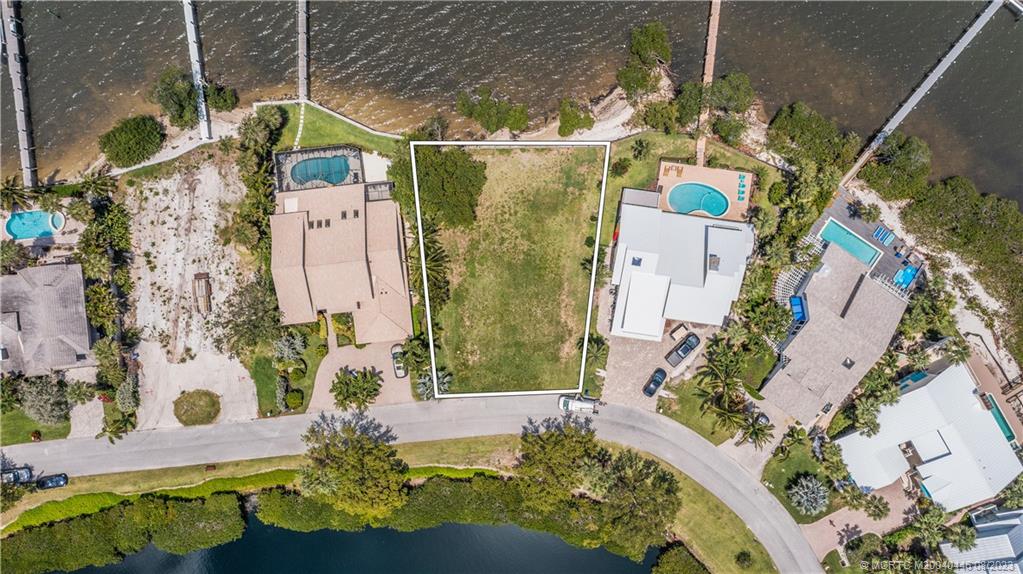 4070 Northeast Joes Point Road Stuart, FL 34996 - Photo 9 of 19 an aerial view of a house