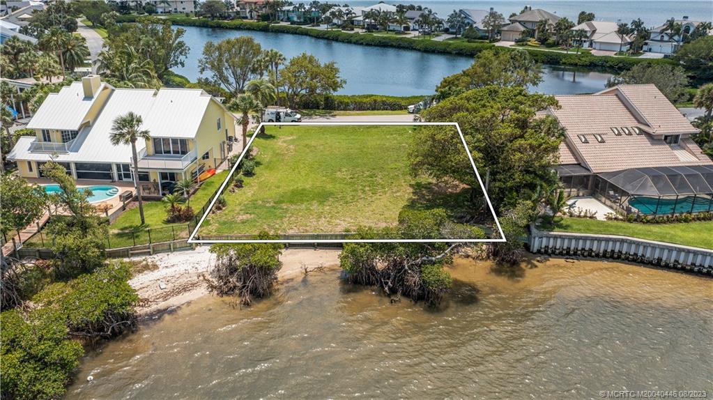 4070 Northeast Joes Point Road Stuart, FL 34996 - Photo 10 of 19 an aerial view of a house with a lake view