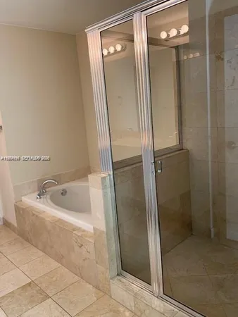 a bathroom with a double vanity sink and mirror