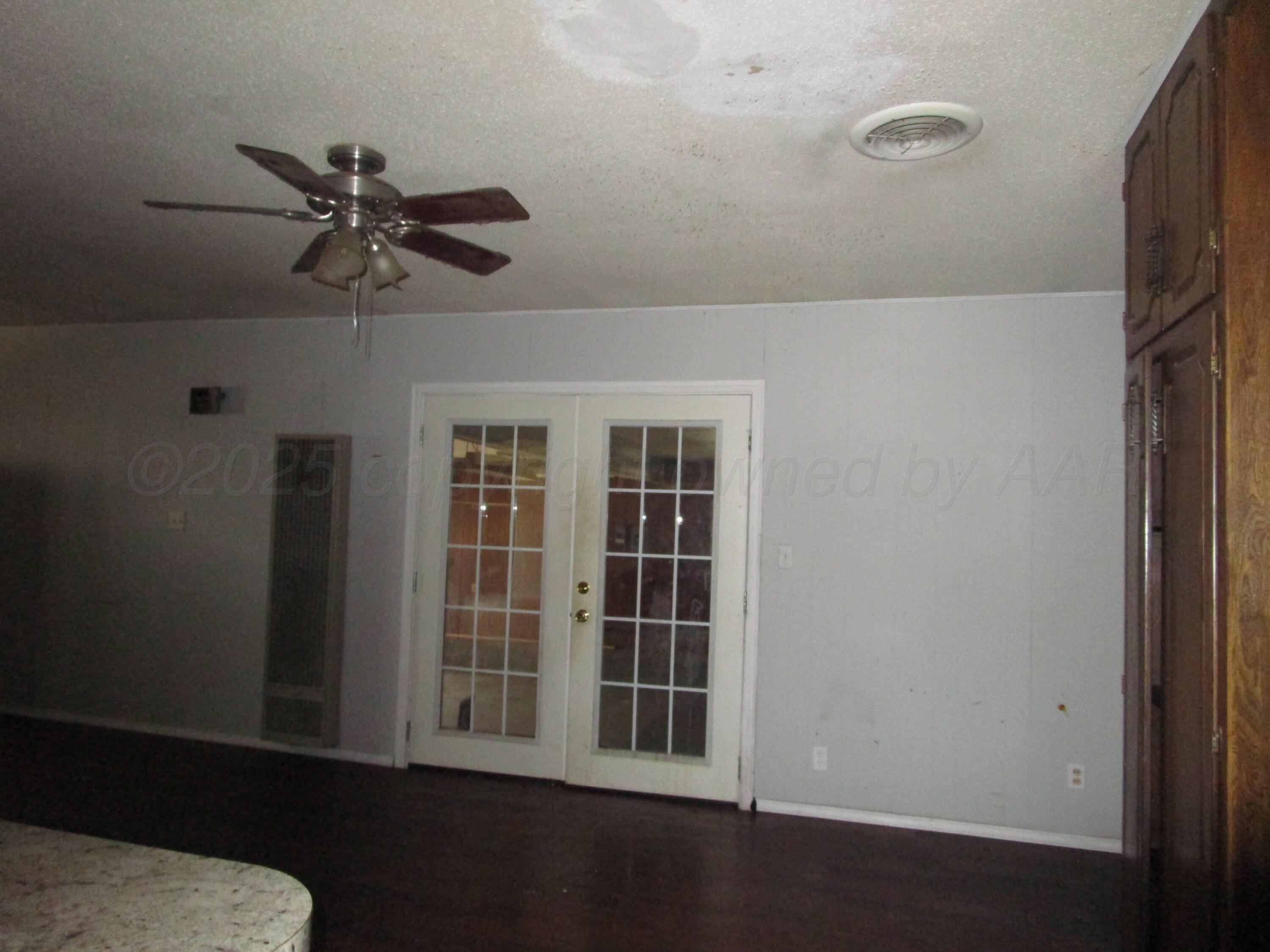 207 Chaparral Street Borger, TX 79007 - Photo 8 of 24 Dining Area with French Door going into