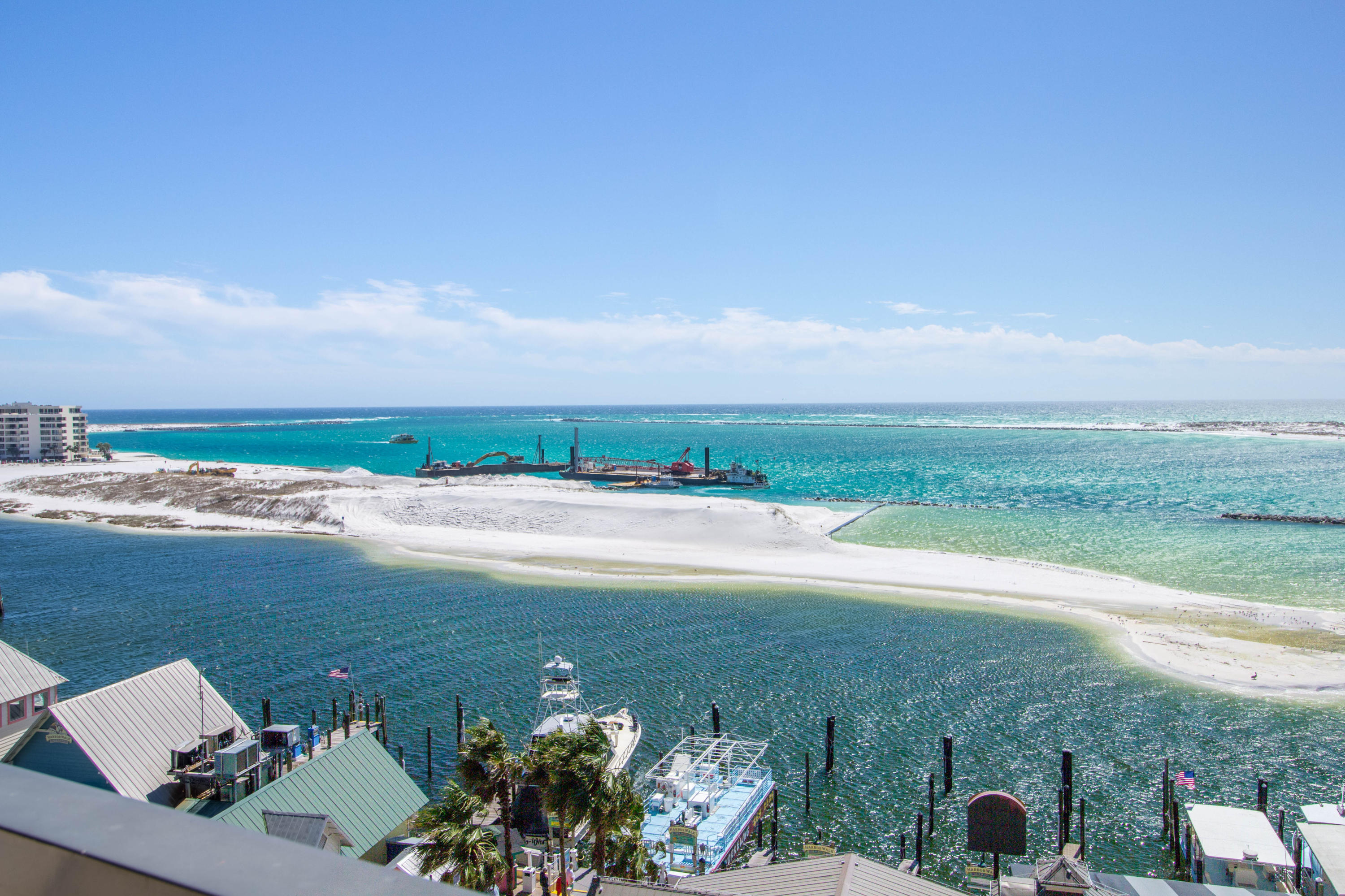 10 Harbor Boulevard, Unit E305E Destin, FL 32541 - Photo 28 of 33 a view of a lake with a mountain in the background