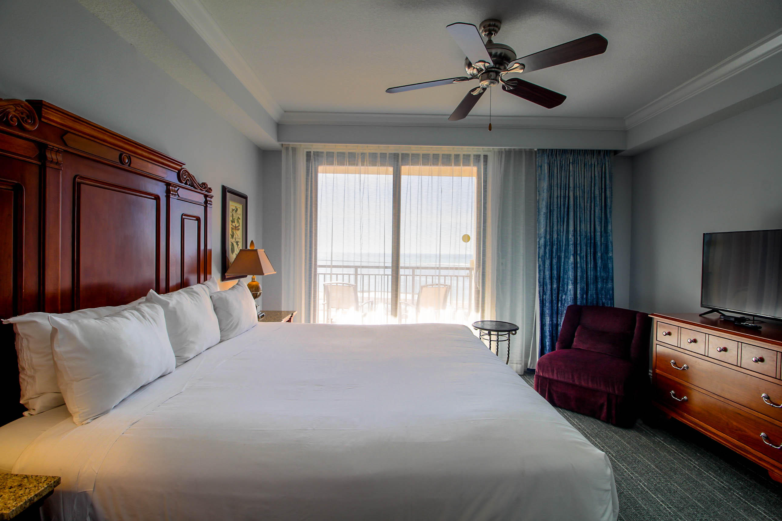 10 Harbor Boulevard, Unit E305E Destin, FL 32541 - Photo 10 of 33 a bedroom with a bed and a couch