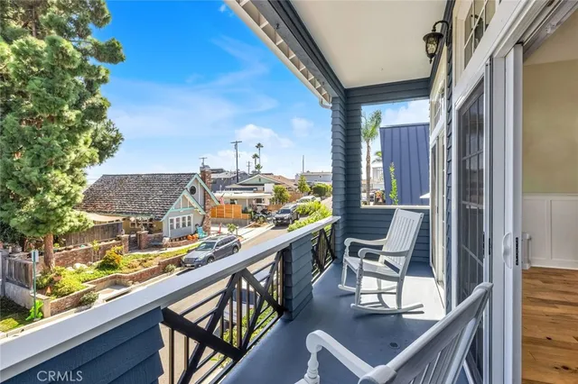 a view of a balcony with chairs