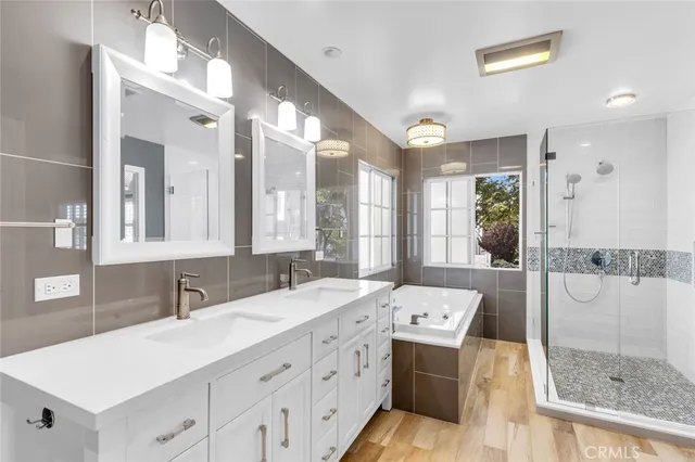 a bathroom with a sink double vanity and a mirror