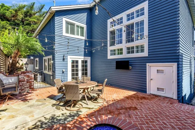 a view of backyard with a patio