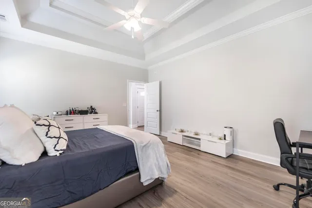 a bed room with a bed and a chair