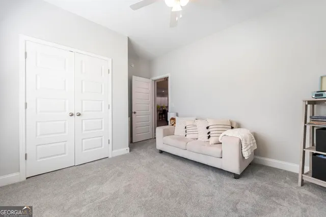 a bed room with a bed and a night stand