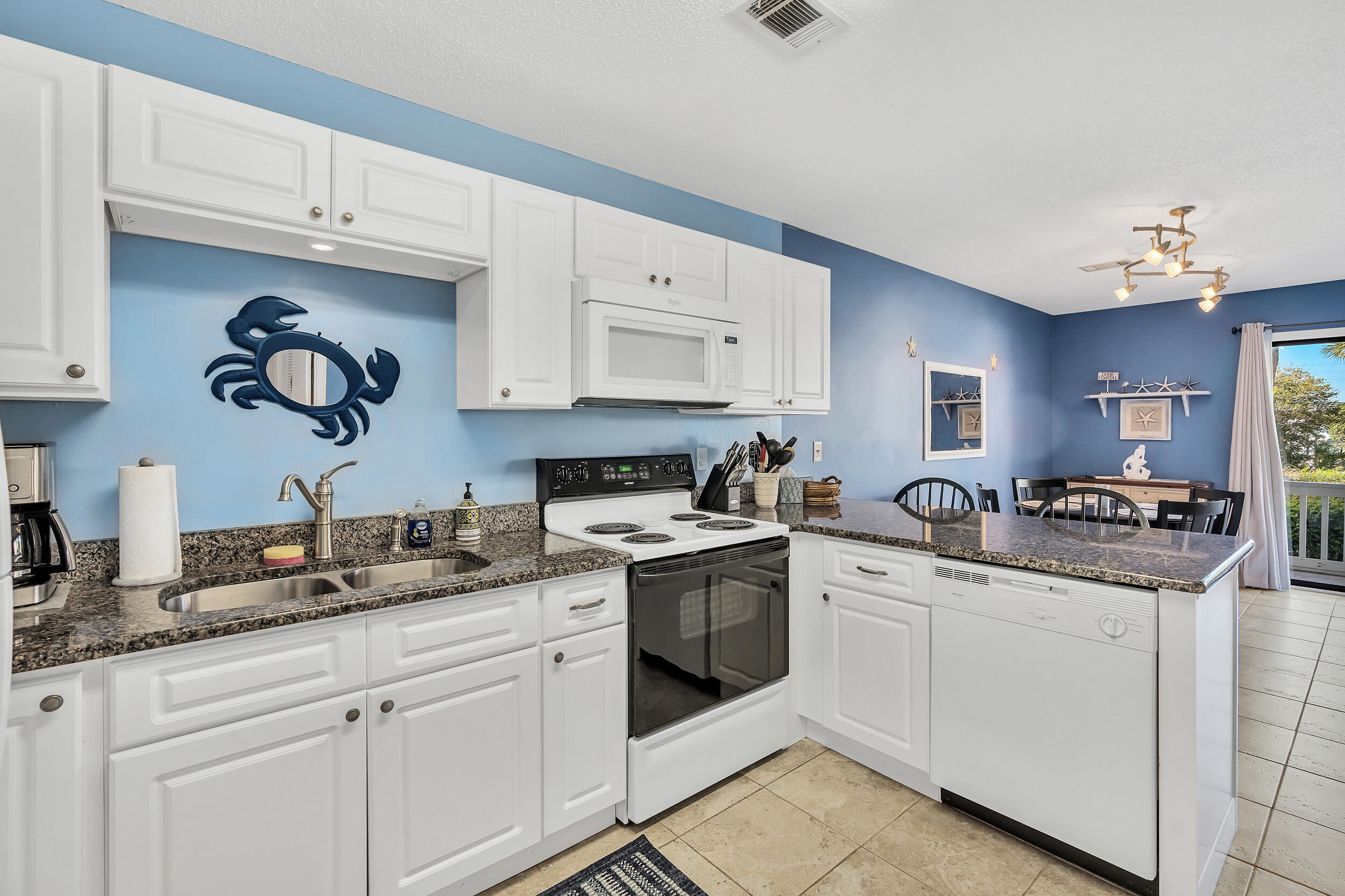 3799 East County Highway 30A, Unit C8 Santa Rosa Beach, FL 32459 - Photo 14 of 49 a kitchen with granite countertop cabinets stainless steel appliances and a sink