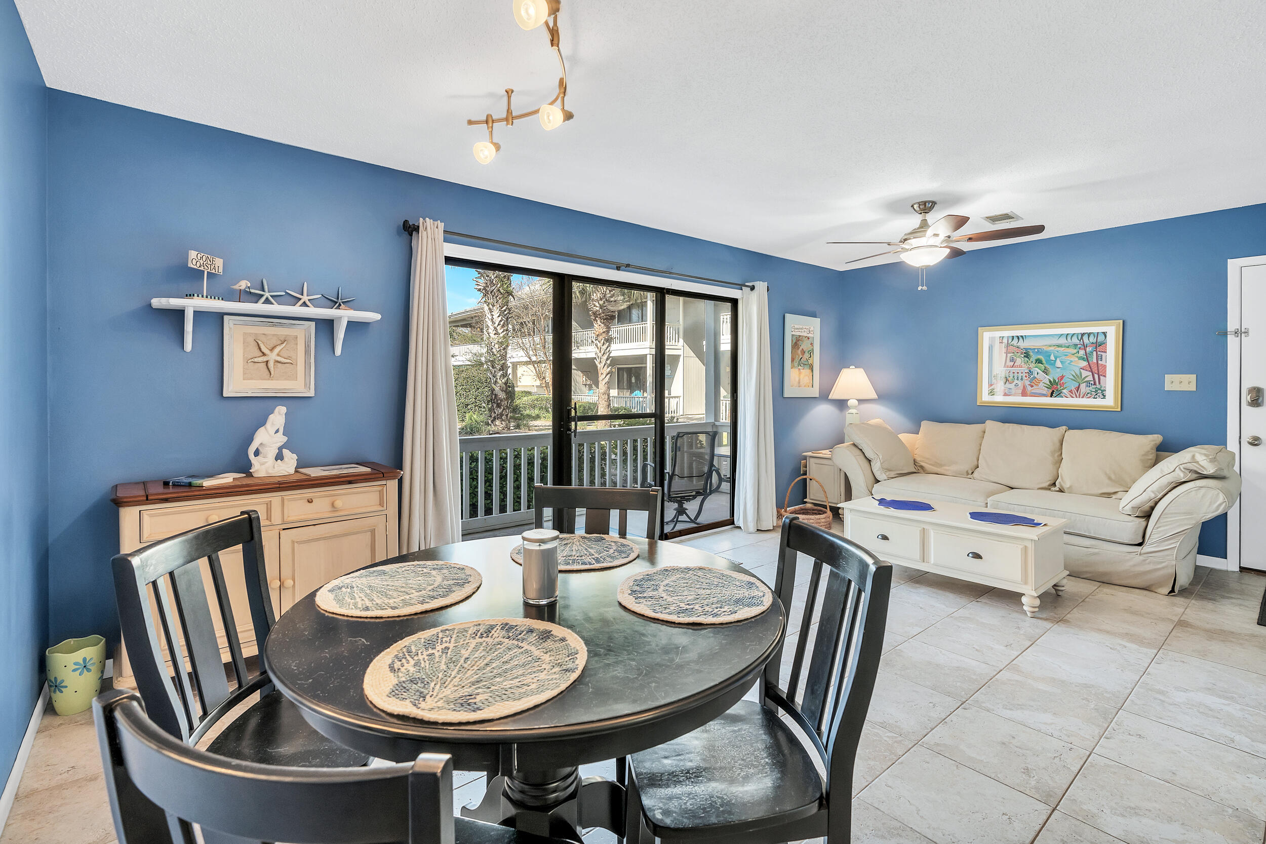 3799 East County Highway 30A, Unit C8 Santa Rosa Beach, FL 32459 - Photo 3 of 49 a living room with furniture a table and a large window