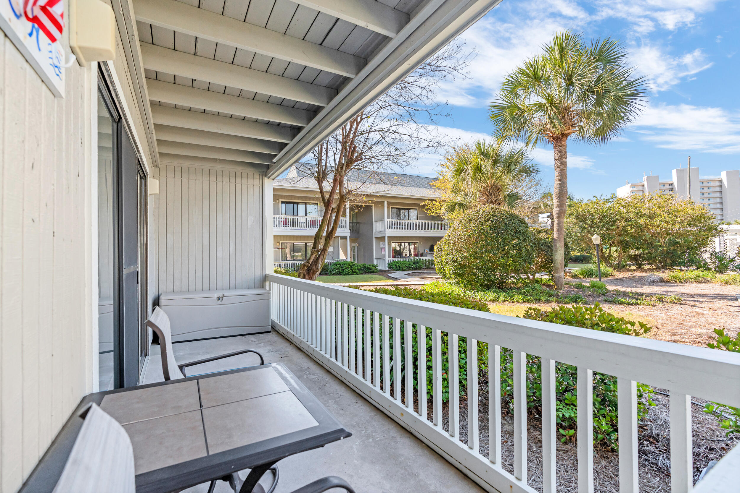 3799 East County Highway 30A, Unit C8 Santa Rosa Beach, FL 32459 - Photo 7 of 49 a view of a porch with furniture and a yard