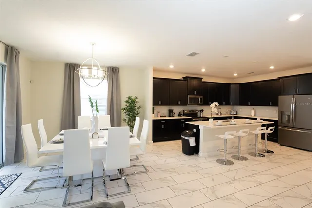 a living room with furniture wooden floor and a window