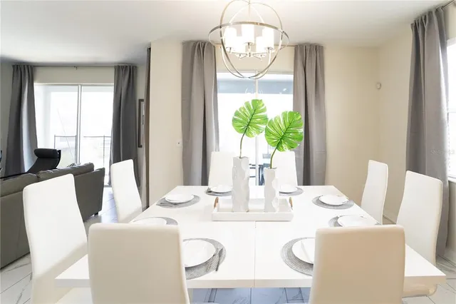 a living room with furniture wooden floor and a flat screen tv