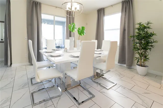 a living room with furniture a flat screen tv and a couch