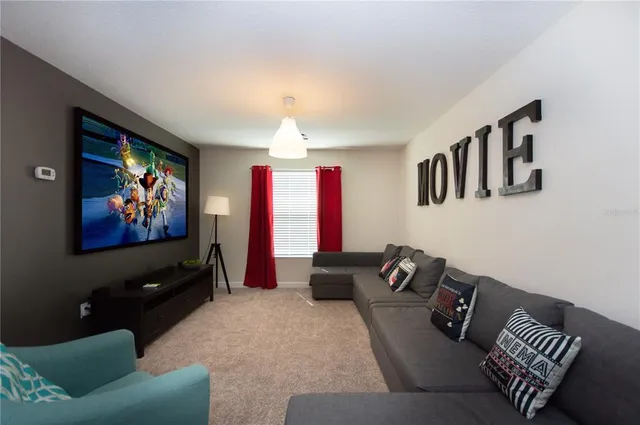 a bedroom with a bed and a lamp