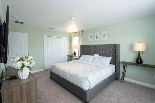 a bathroom with a sink a toilet and shower curtain