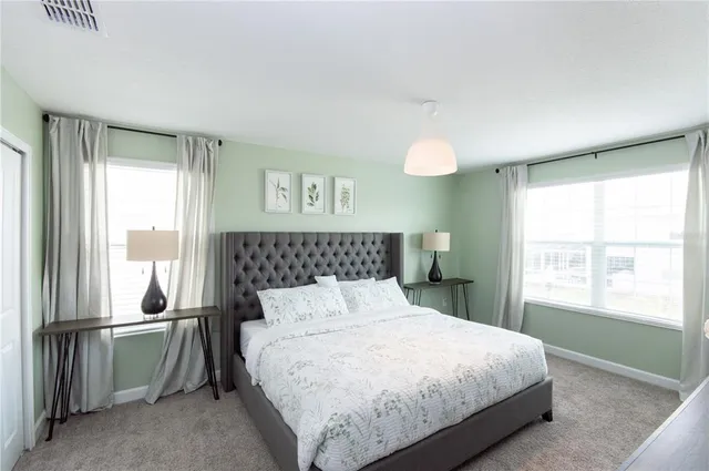 a bathroom with a sink vanity mirror and toilet