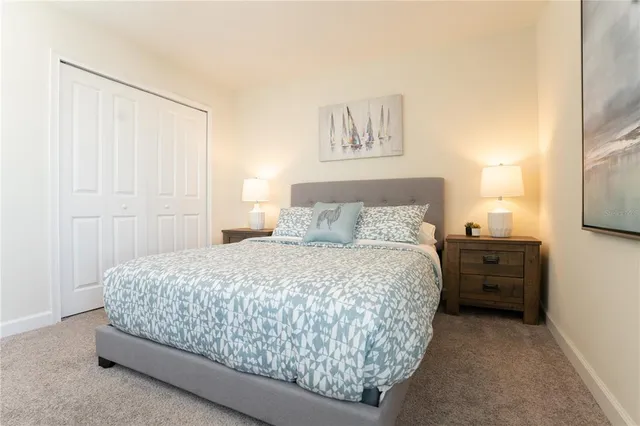 a bathroom with a double vanity sink a mirror and a bathtub