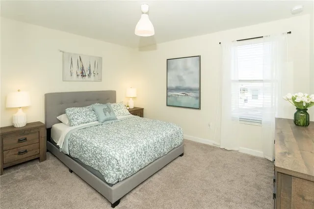 a bathroom with a sink toilet vanity and shower