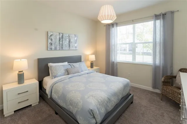 a view of a swimming pool with a patio and a yard