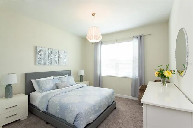 a view of a balcony with chair and a potted plant