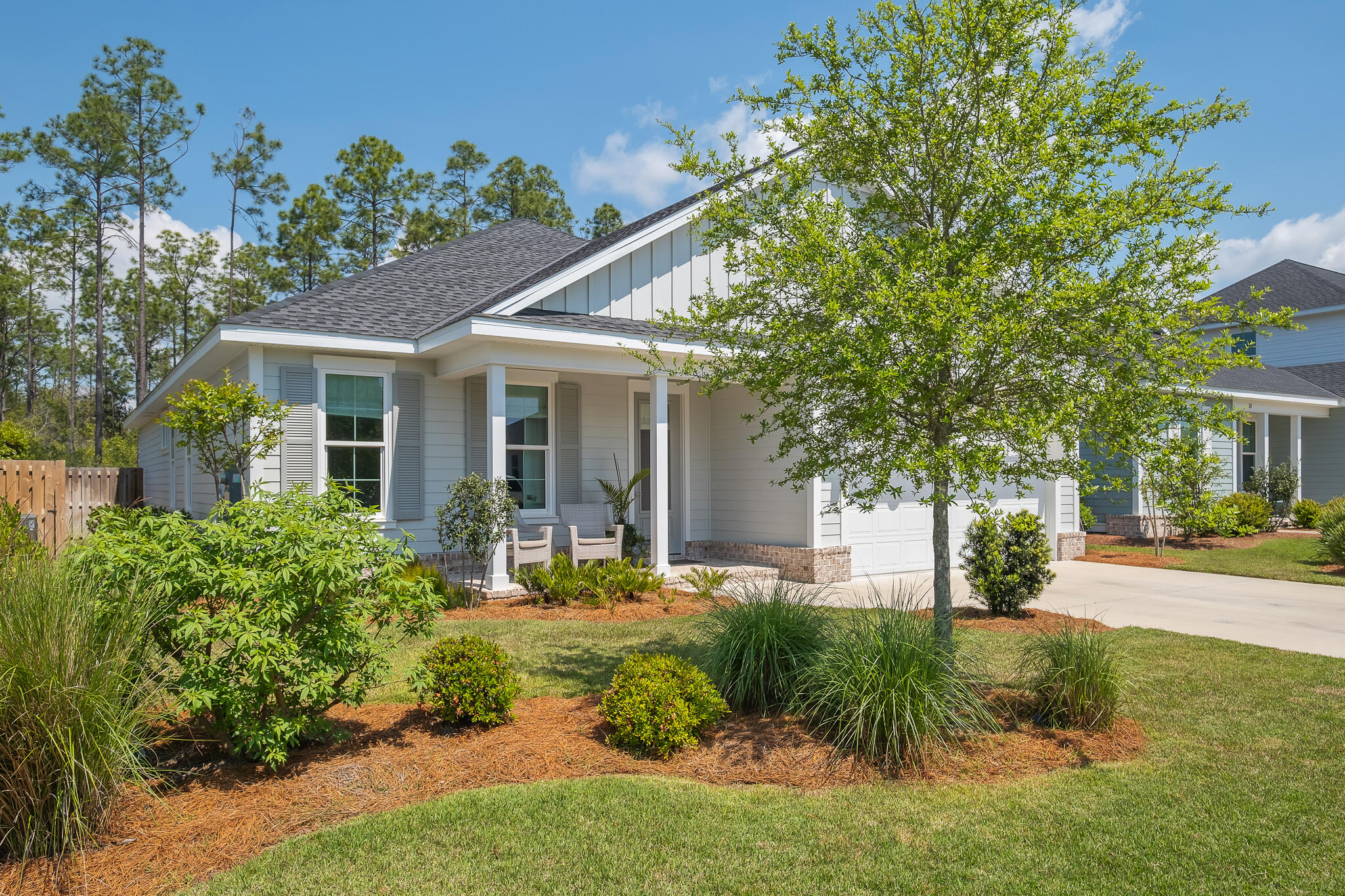 a front view of a house with garden