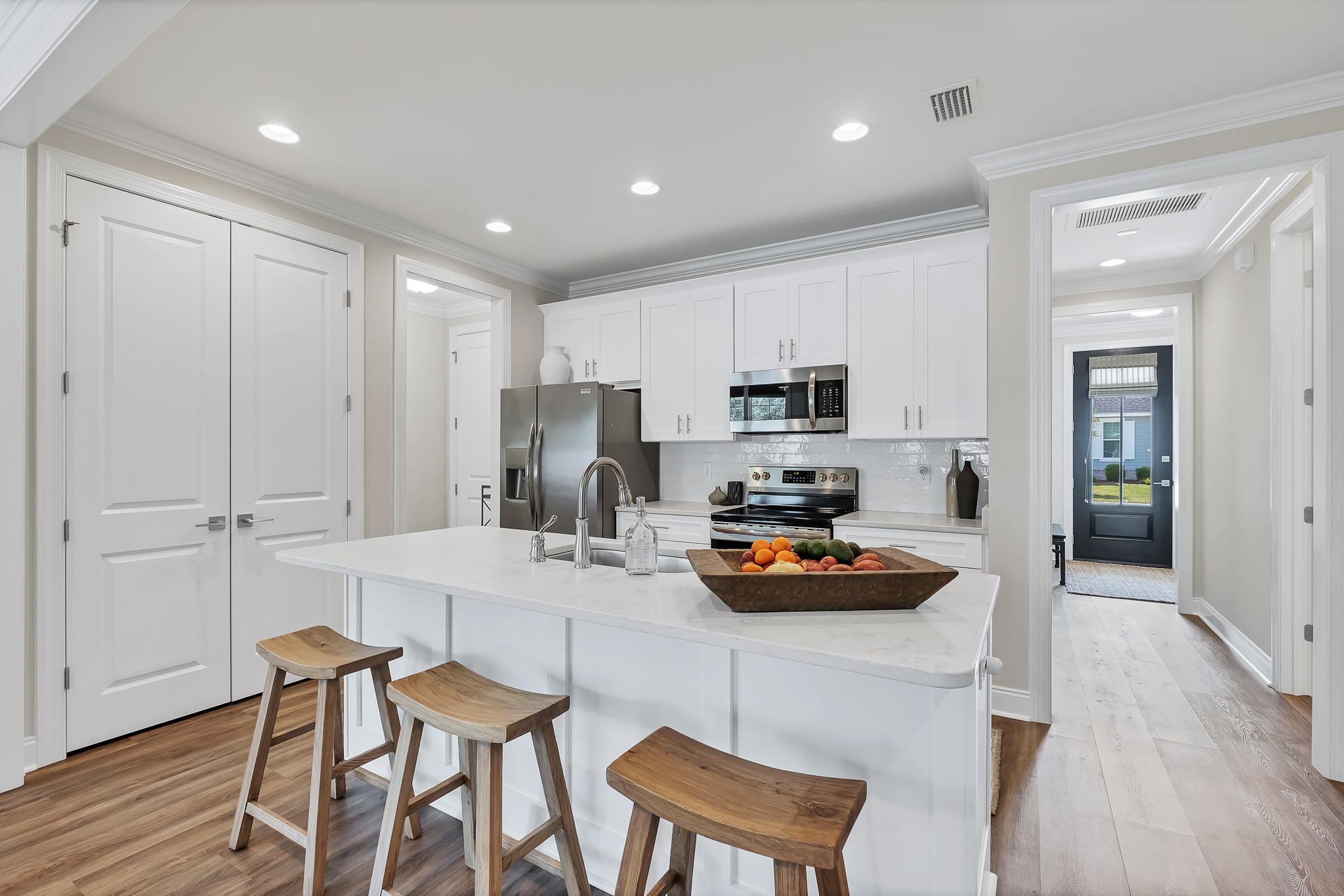 21 Windrow Way Inlet Beach Inlet Beach, FL 32461 - Photo 16 of 58 a kitchen with white cabinets and stainless steel appliances