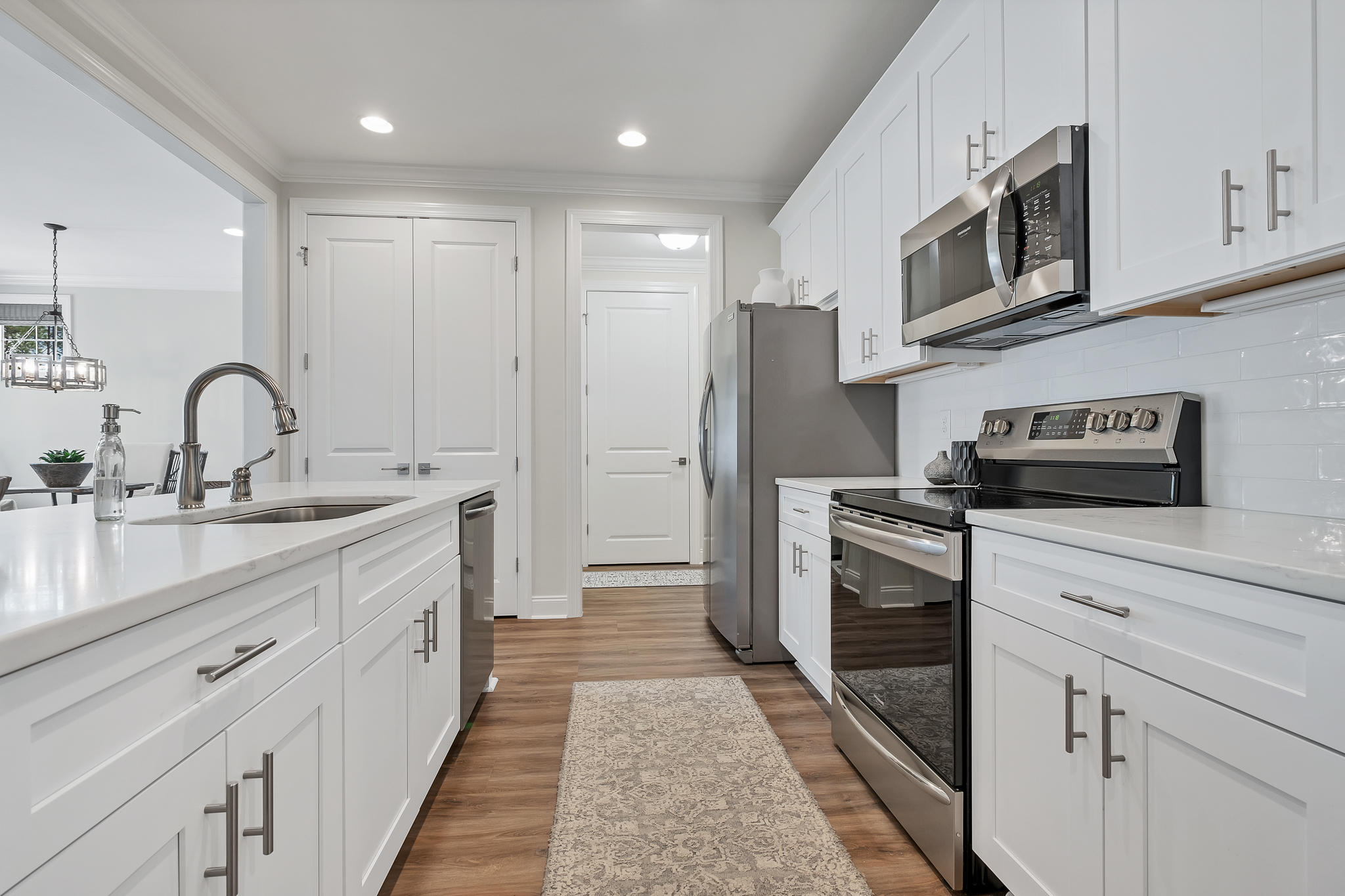 21 Windrow Way Inlet Beach Inlet Beach, FL 32461 - Photo 17 of 58 a kitchen with stainless steel appliances kitchen island granite countertop a refrigerator and a sink