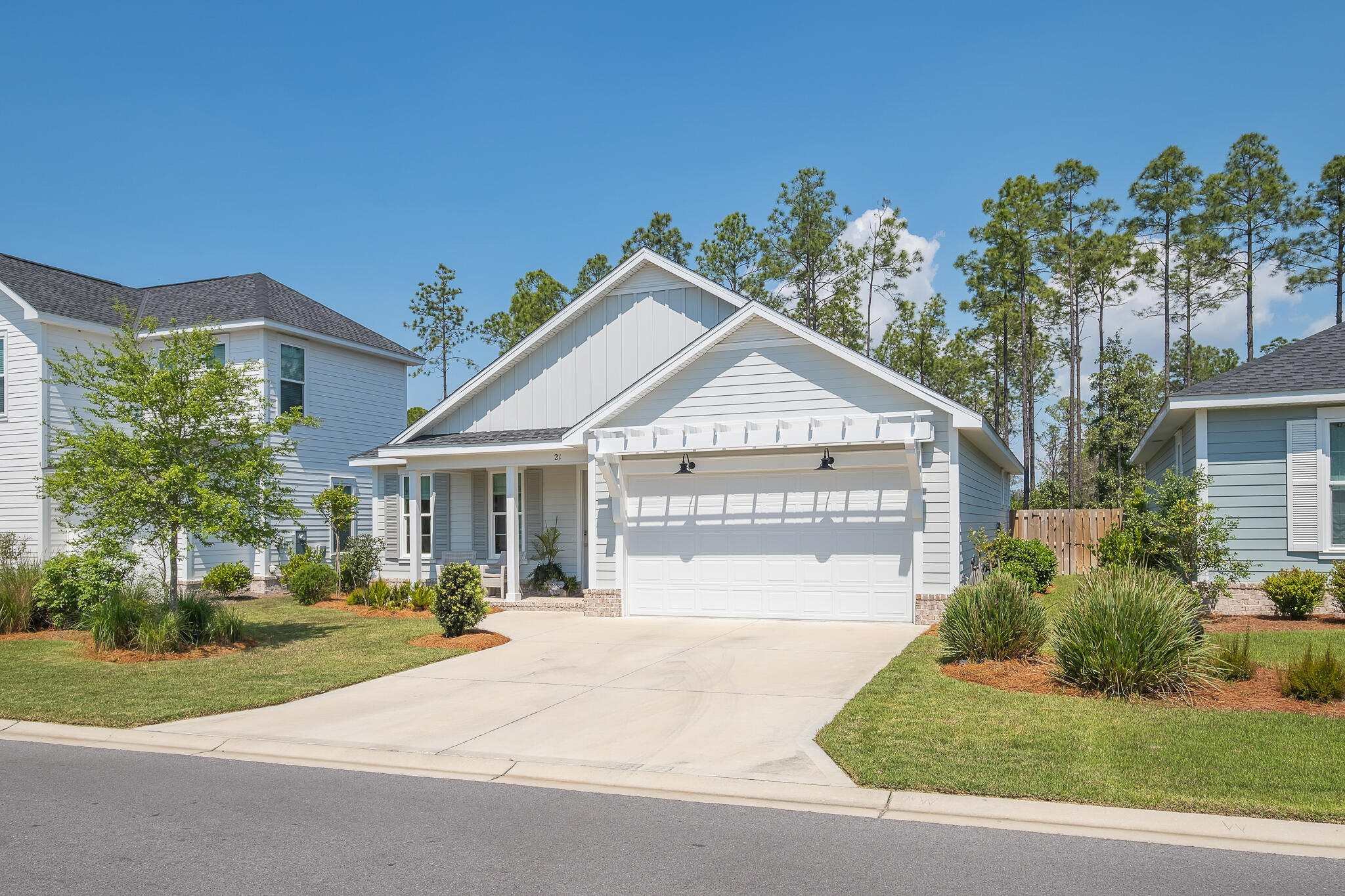 21 Windrow Way Inlet Beach Inlet Beach, FL 32461 - Photo 33 of 58 a front view of a house with a yard and garage